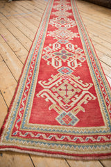 Hand-knotted Oushak runner fringe and geometric end border in cherry red, sky blue.