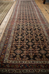 Angled view showing the slight contour and allover Herati design of the antique Hamadan runner.