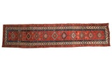 Antique Northwest Persian runner with interconnected diamond medallions, tribal motifs, and geometric borders in red, blue, and ivory.