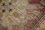The weaver's inscribed date woven into the geometric pattern of an antique Kazak rug.