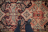 Antique Karabagh runner's hand knotted pile with sprawling red, ivory, and navy rococo leaves and botehs.