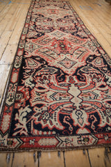 Worn navy, ivory, and red rococo and paisley motifs on this antique Karabagh runner.