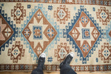 Overhead view showing the scale of the large diamond medallions on a distressed Kars runner.