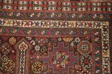 Intricate corner of a Persian Qashqai runner showing multiple borders with hook and latch relief.