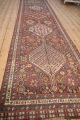 Repeating hexagonal medallions and minor guls along the length of an antique Qashqai runner.