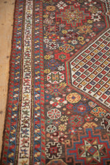 Detail of the intricate border design and minor guls on an antique Persian Qashqai runner.