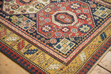 Antique Kazak runner's serrated leaf main border and Laleh Abbasi reciprocating minor border.