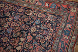 Detailed view of a vintage Bijar rug runner's navy Herati field and expressive floral borders.