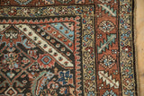 Detail of rainbow-like corner spandrels and floral borders on an antique Northwest Persian runner.