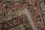 An antique Persian rug's corner showing its knot heads, foundation, and restored side cord.