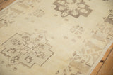 Even wear across the low pile of a distressed Oushak runner with geometric motifs.