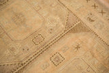 Distressed Oushak runner pile in cream and antique ivory, with textured knot heads and geometric detail.