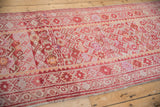 Vintage Kurd runner featuring geometric guls, pinwheel florals, and fuchsia abrashes.