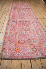 Vintage distressed Kurd rug runner end, with short fringe and geometric guls in fuchsia, tangerine.