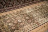 Vintage Sivas runner's allover field of green and pale pink floral roundel medallions.