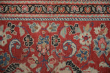 Low pile texture of a vintage Persian Arak rug showing the brick red floral field and main border.