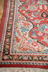 The charcoal black main border showing a meandering vine and blossom design.