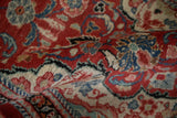 Close-up view of the dense, hand-knotted wool pile on the vintage Persian Arak rug runner.