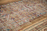 Meandering serpent main border and geometric floral motifs on this antique Serab runner.