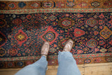 Vintage Bijar runner with interconnected palmettes and diamond shapes in navy, red, and gold.