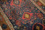 Hand-knotted vintage Bijar runner detail: navy field, madder root red interconnected palmettes, ivory border.