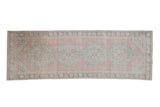 Distressed vintage Oushak runner, time-softened blush, silver, and ivory hexagonal medallions, 3'1