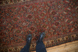 Overhead detail of the intricate Herati pattern and low pile on a vintage Bijar runner.