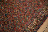 Detailed Herati design in faded brick red and sky blue on a vintage Persian Bijar runner.