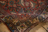 A soft wave in a vintage Persian Bijar runner reveals the dense wool pile and floral border detail.