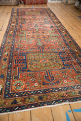 Detail of antique Heriz runner, brick red field, sapphire blue turtle design motifs, and intricate vine patterns.