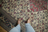 A vintage Khorassan carpet showing the ivory Herati field, serrated red medallion, and navy Samovar Turtle border.