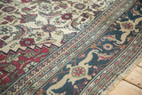 Samovar Turtle design motif in the dusty navy blue border of a vintage Khorassan carpet.