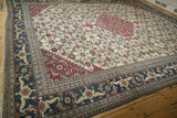 Angled view of a vintage Khorassan showing the Samovar Turtle border and Herati motif field.