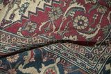 A close view of the vintage Khorassan carpet's hand-knotted Samovar Turtle border design.