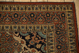 Rococo-stylized corner spandrel and intricate vine borders of an antique Haji Jalili Tabriz rug.