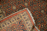 Finely knotted structure and side cord selvage of an antique Haji Jalili Tabriz rug corner.