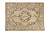 Vintage Tabriz rug with beige field, navy blue scalloped medallion, Safavid borders, 4'1