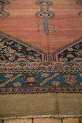 Hand-knotted texture of the serrated leaf border on an antique Persian Hamadan runner.