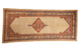 Antique Serab runner with a diamond medallion, camel lattice field, and multi-colored geometric borders.