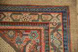 Reciprocating pawn design motif in the colorful striated borders of an antique Persian Serab rug corner.