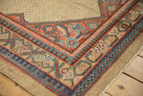 Colorful striations in the geometric pawn motif border of an antique Persian Serab runner rug.