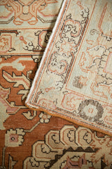 Hand-knotted back and secured side selvage of a distressed Persian Tabriz carpet.