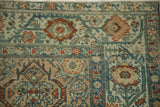 Detailed serbend vine border and low-pile texture on a vintage Persian Malayer rug.