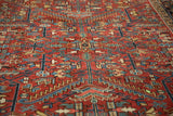 Low-angle perspective of a vintage Heriz carpet highlighting the hand-knotted pile texture.
