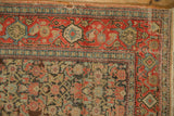 Antique Senneh corner showing wear to knot heads on the intricate field and border pattern.
