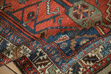 A folded vintage Kurdish Hamadan rug runner showing its dense, hand-knotted pile and varied texture.