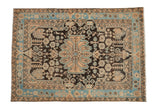 Vintage distressed Hamadan rug with a geometric medallion, dark brown field, and a sky blue border.