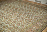 Distressed vintage Hamadan rug showing boteh field and Samovar border motif in muted tones.