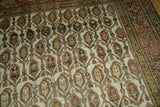 Distressed Hamadan vintage rug detail: ornate boteh lattice field in terracotta and platinum.