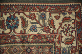 Oversized Herati border design showing even wear and visible knot heads.